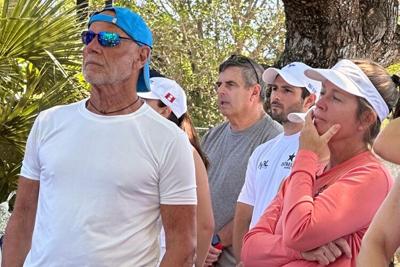 Jon Garito with others participants listening to Jeanne Viergutz's explain the Coll Goal's mission